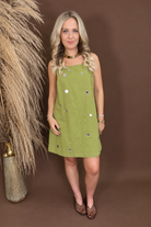 Model wearing the Chartreuse Mirrored Sequin Shift Dress from Moda Boutique