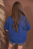 Model wearing the Dark Denim Button Up Shirt from Moda Boutique
