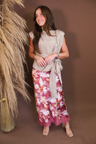 Model wearing the Mauve Floral Satin Midi Skirt from Moda Boutique