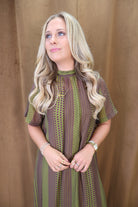 Olive Printed Tie-Back Midi Dress — close-up of high neckline and print.