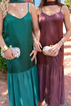 Emerald green satin slip maxi dress with adjustable straps and a detachable neck scarf