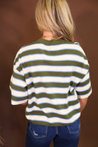 Model wearing the Short Sleeved Lightweight Sweater Top - Green Stripe from Moda Boutique