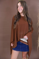 Chocolate sheer batwing poncho top layered over included cami