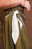 Model wearing the Olive Bubble Midi Dress with Scarf from Moda Boutique