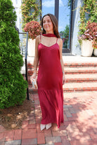 Burgundy satin slip maxi dress with adjustable straps and a detachable neck scarf