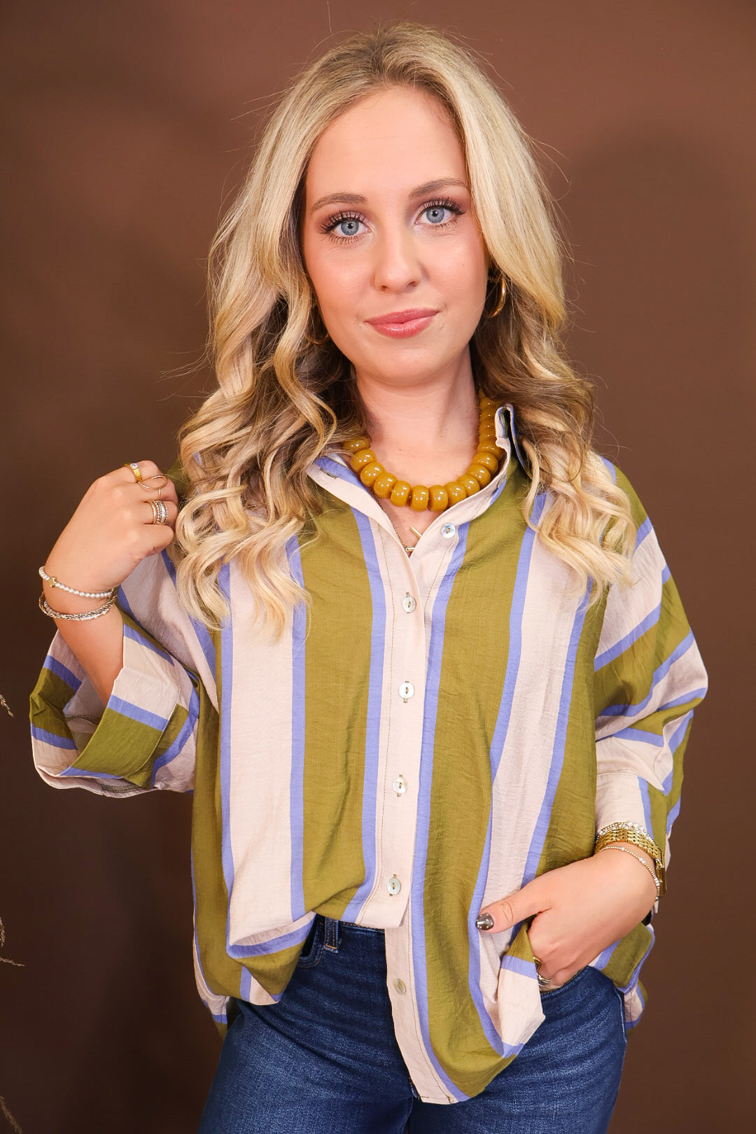 Model wearing the Olive & Blue Striped Button Down Top from Moda Boutique