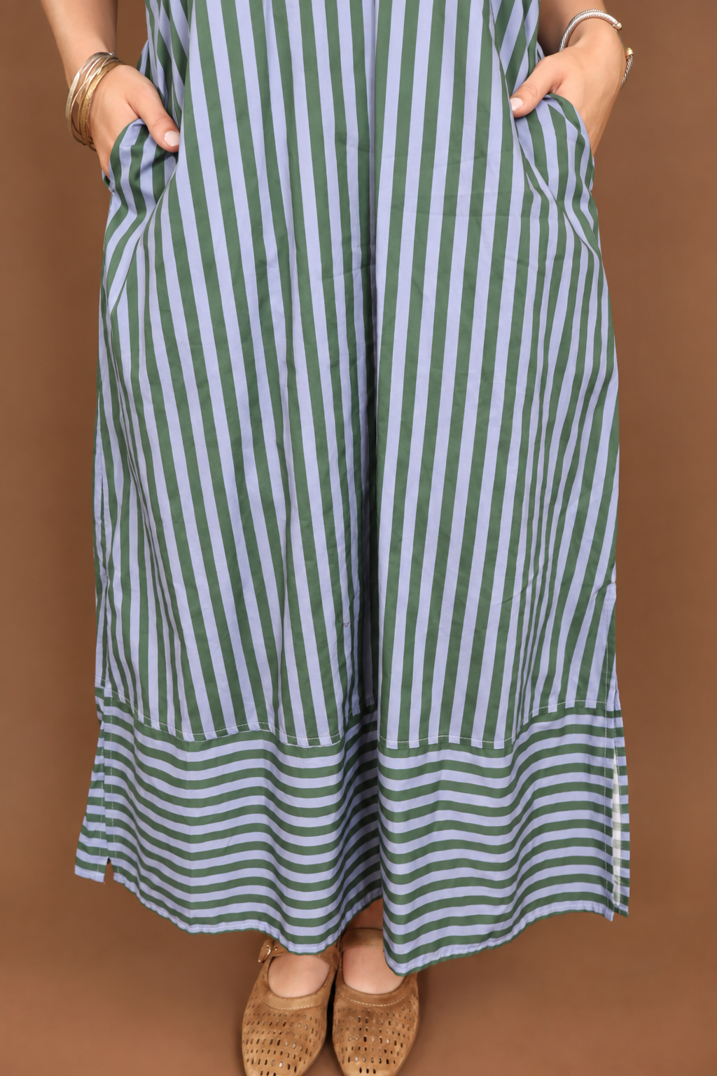 Model wearing the Blue Green Striped Midi Dress from Moda Boutique