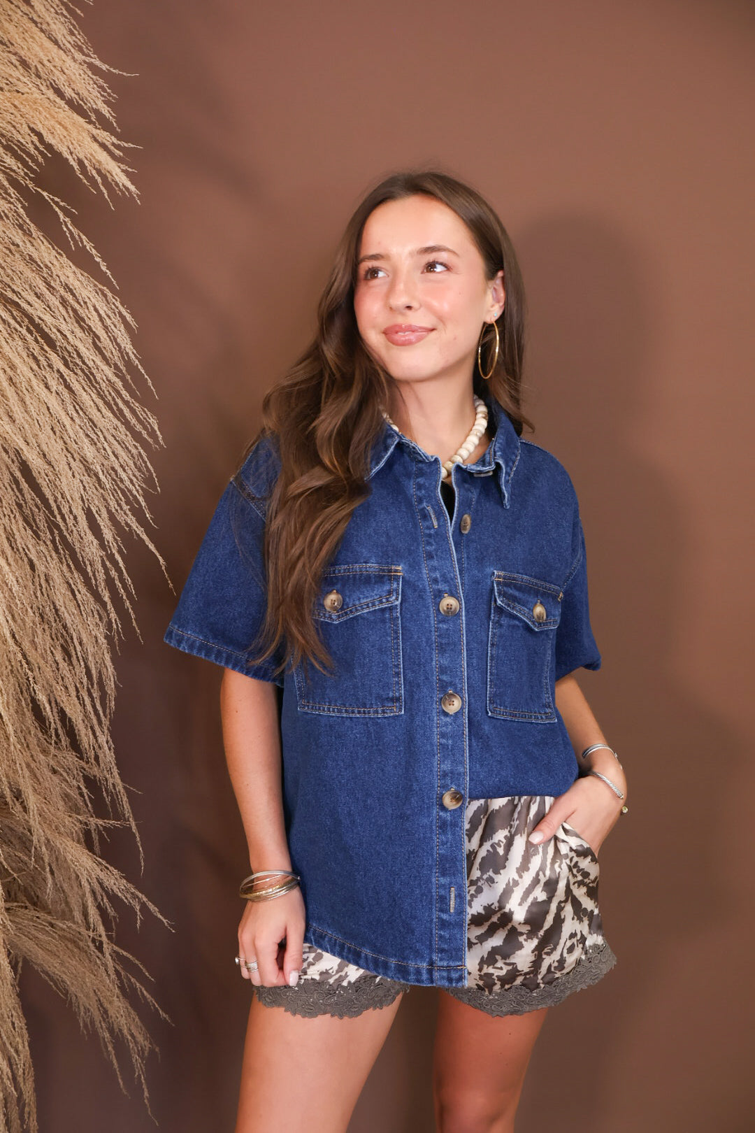 Model wearing the Dark Denim Button Up Shirt from Moda Boutique
