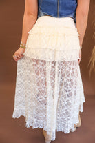 Cream lace skirt-overlay shorts with high-low hemline