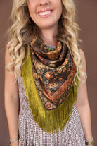 Green Deer Print Fringe Square Scarf — close-up of neck styling.