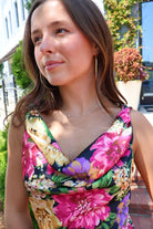 Black floral satin maxi dress with twisted straps and a draped cowl neckline