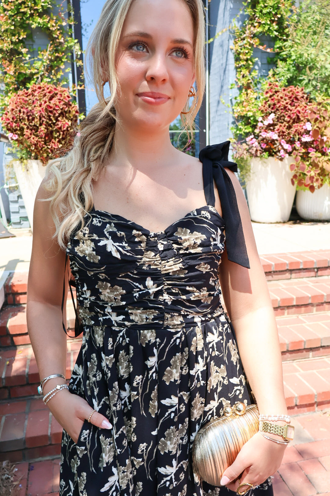 Black maxi dress with gold floral embroidery and ribbon shoulder ties