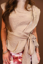 Model wearing the Taupe Waist Tie Sleeveless Top from Moda Boutique
