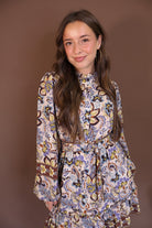Floral Print Belted Long Sleeve Mini Dress — close-up of high neckline.