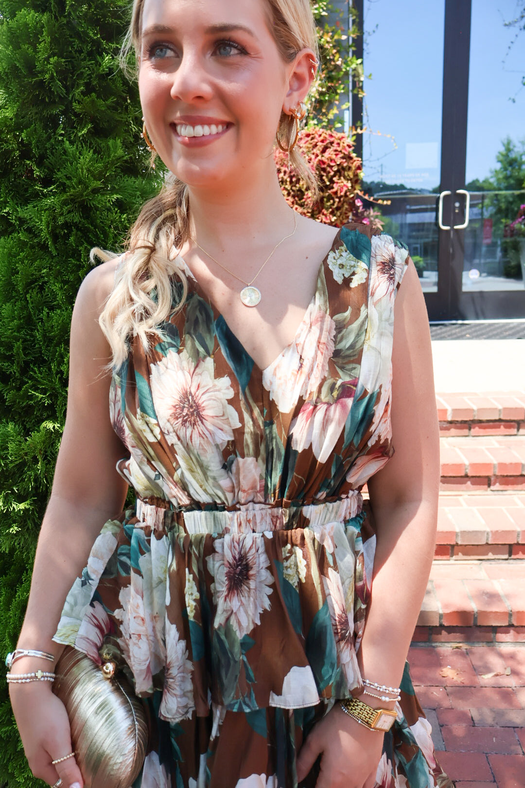 Brown floral tiered maxi dress with a V-neck and ruffled skirt