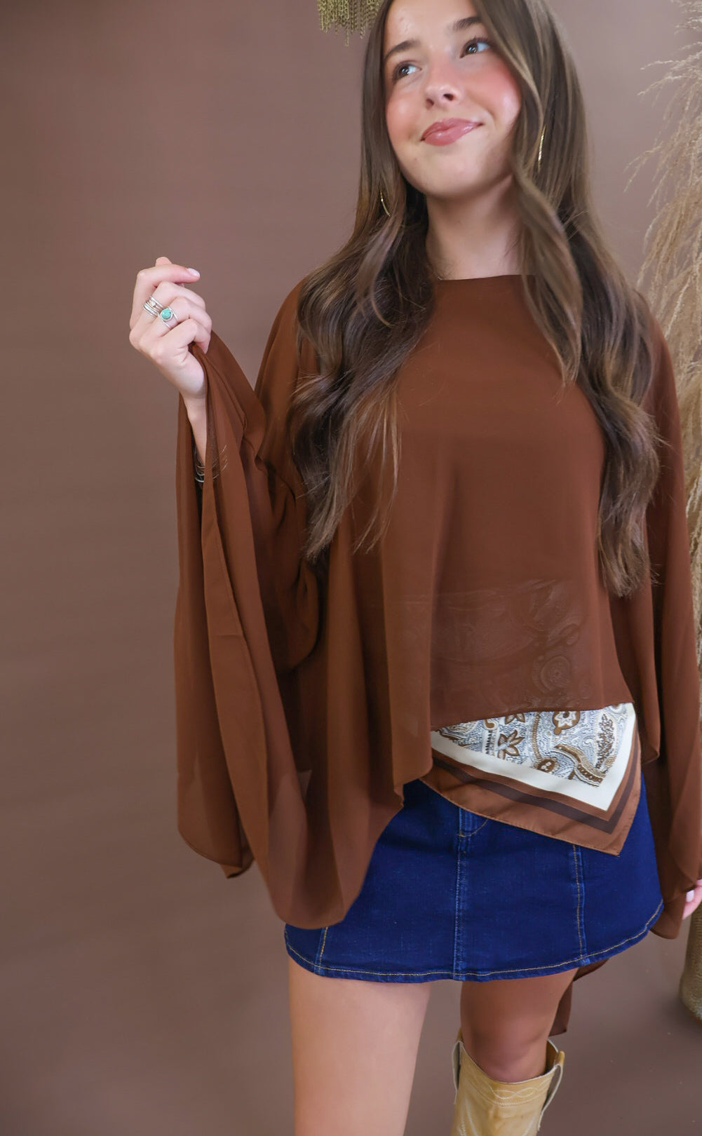 Chocolate sheer batwing poncho top layered over included cami