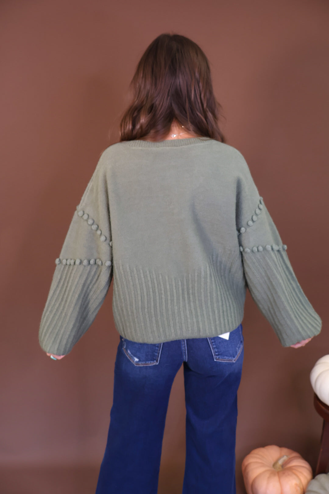 Olive Pom Pom Knit Cardigan — back view.