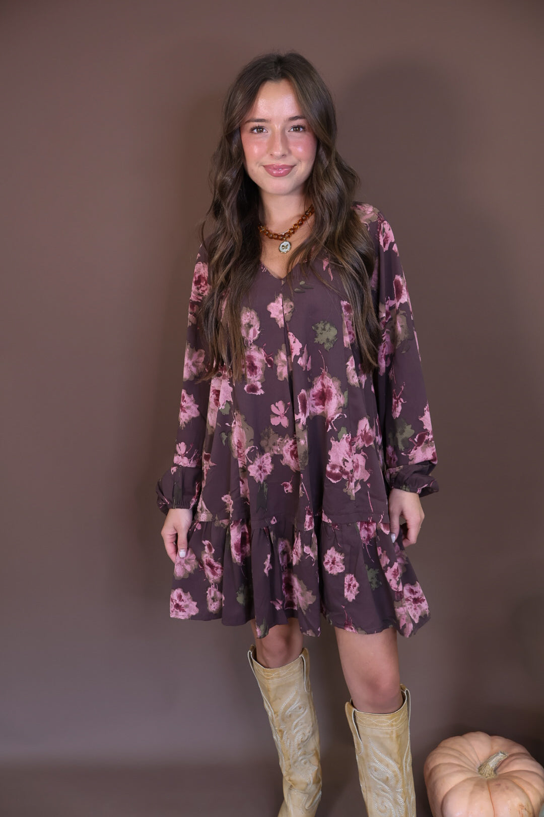 Brown Floral Tiered Babydoll Mini Dress — front view.