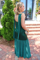 Emerald green satin slip maxi dress with adjustable straps and a detachable neck scarf