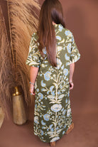 Model wearing the Olive Blue Floral Midi Dress from Moda Boutique