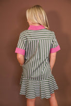 Model wearing the Olive Striped Button Front Dress from Moda Boutique