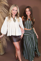 Model wearing the Cream Pintuck Quarter Sleeve Top from Moda Boutique