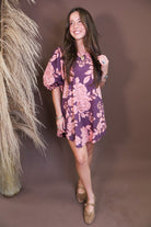 Model wearing the Wine Pink Floral Mini Dress from Moda Boutique