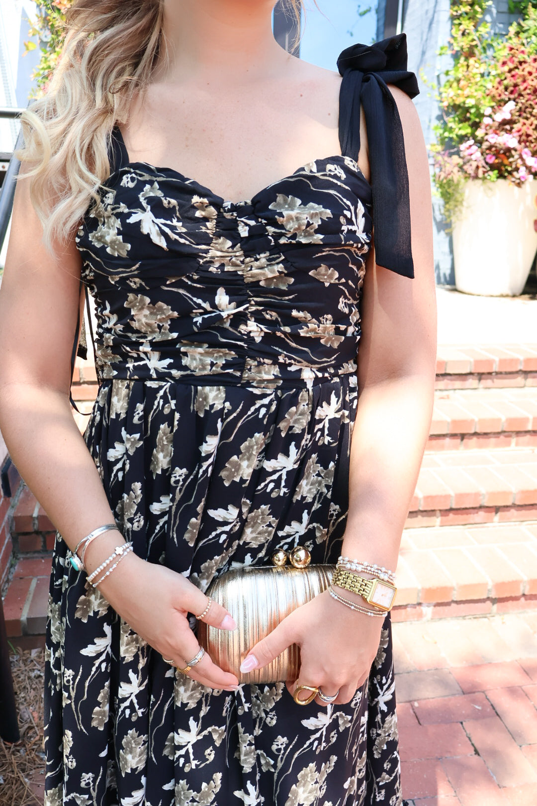 Black maxi dress with gold floral embroidery and ribbon shoulder ties