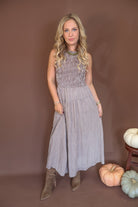 Brown Gingham Smocked Sleeveless Midi Dress — front view.