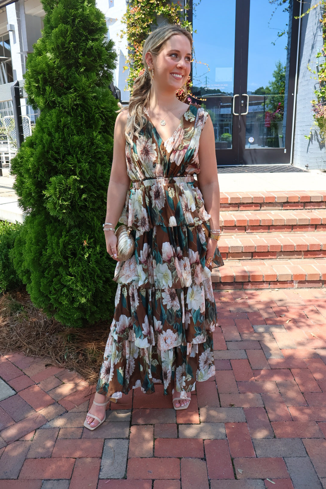 Brown floral tiered maxi dress with a V-neck and ruffled skirt