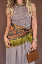 Green Deer Print Fringe Square Scarf — close-up of scarf tied at the waist.