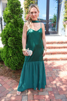 Emerald green satin slip maxi dress with adjustable straps and a detachable neck scarf