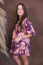 Model wearing the Wine Pink Floral Mini Dress from Moda Boutique