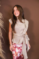 Model wearing the Taupe Waist Tie Sleeveless Top from Moda Boutique