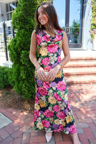 Black floral satin maxi dress with twisted straps and a draped cowl neckline