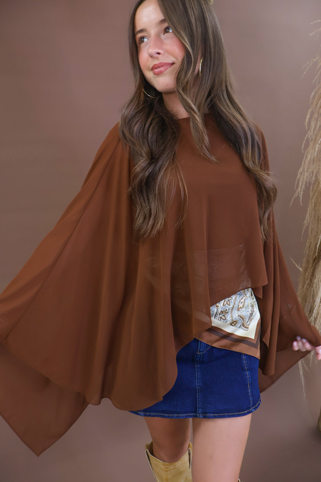 Chocolate sheer batwing poncho top layered over included cami