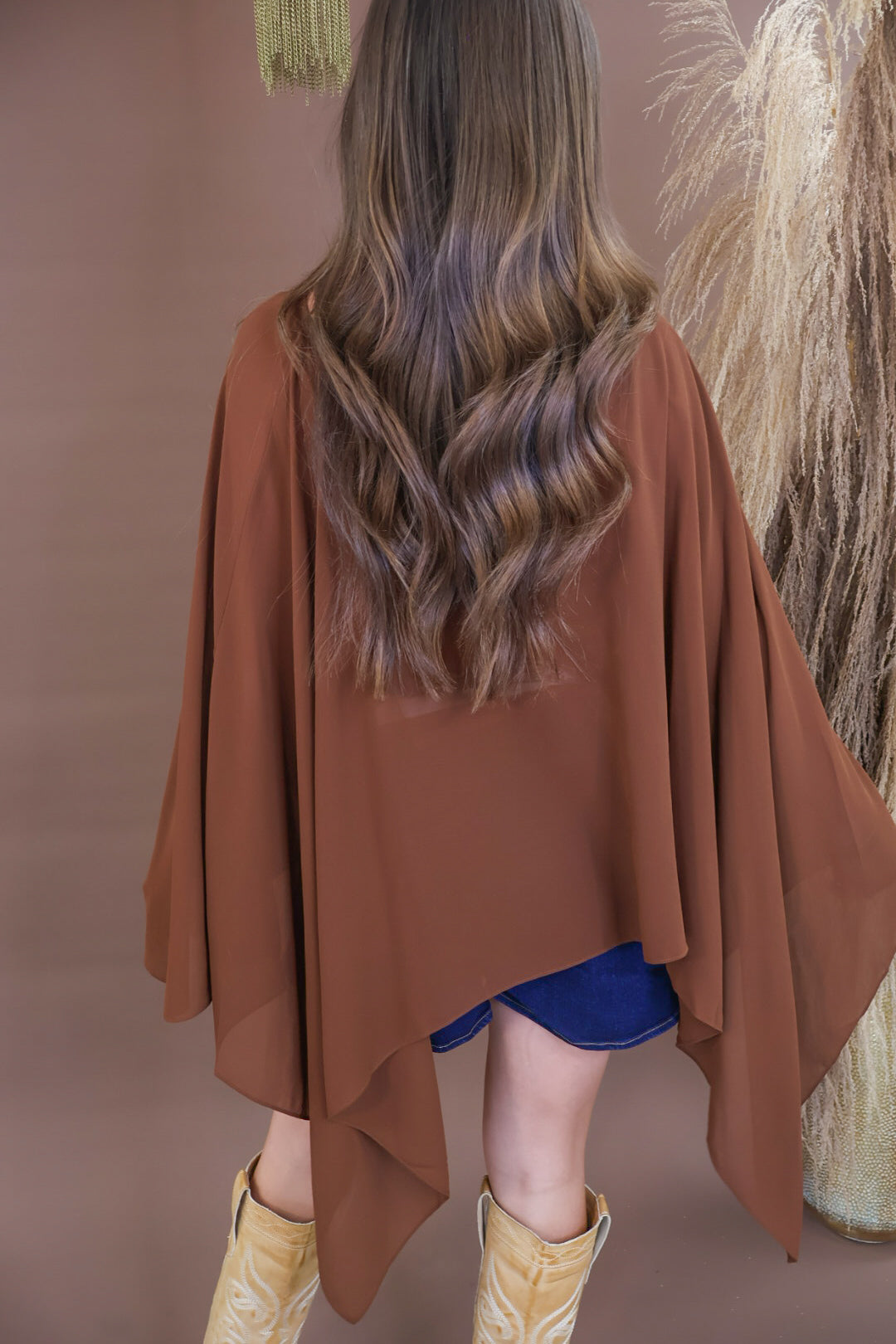 Chocolate sheer batwing poncho top layered over included cami