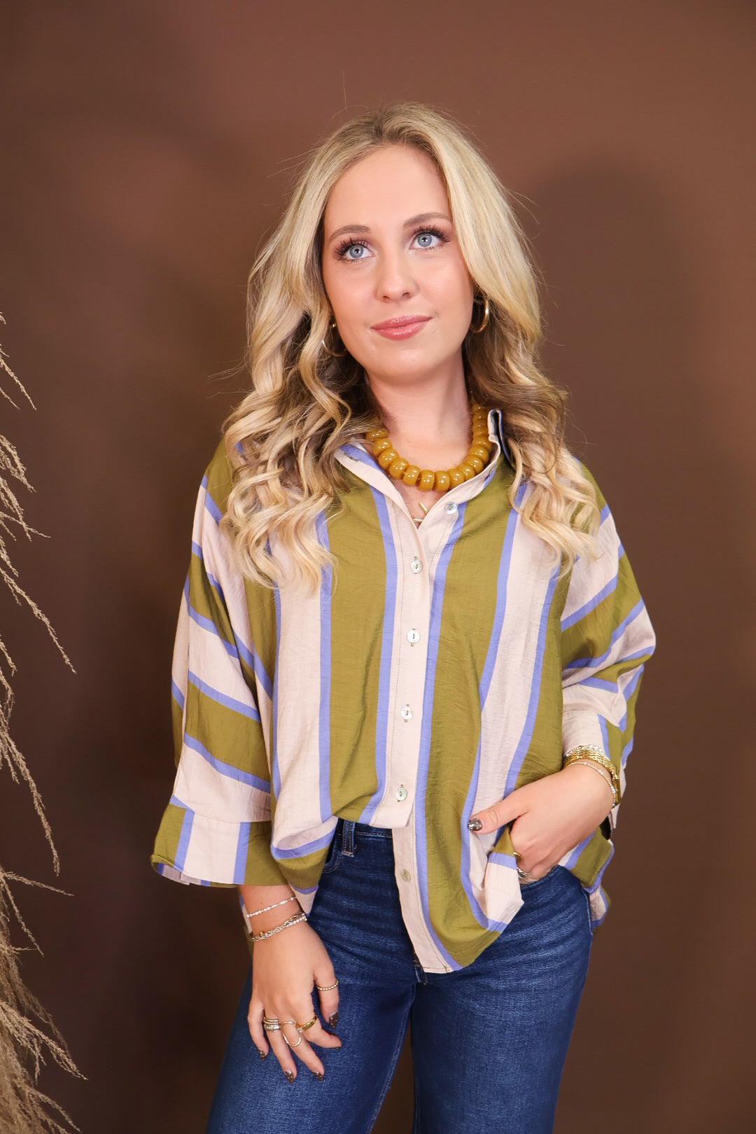 Model wearing the Olive & Blue Striped Button Down Top from Moda Boutique