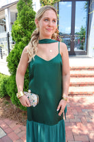 Emerald green satin slip maxi dress with adjustable straps and a detachable neck scarf