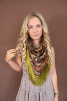 Green Deer Print Fringe Square Scarf — tied at the neck.