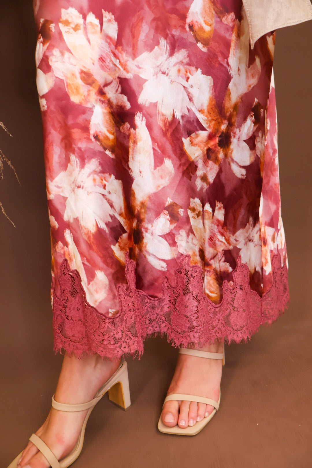 Model wearing the Mauve Floral Satin Midi Skirt from Moda Boutique