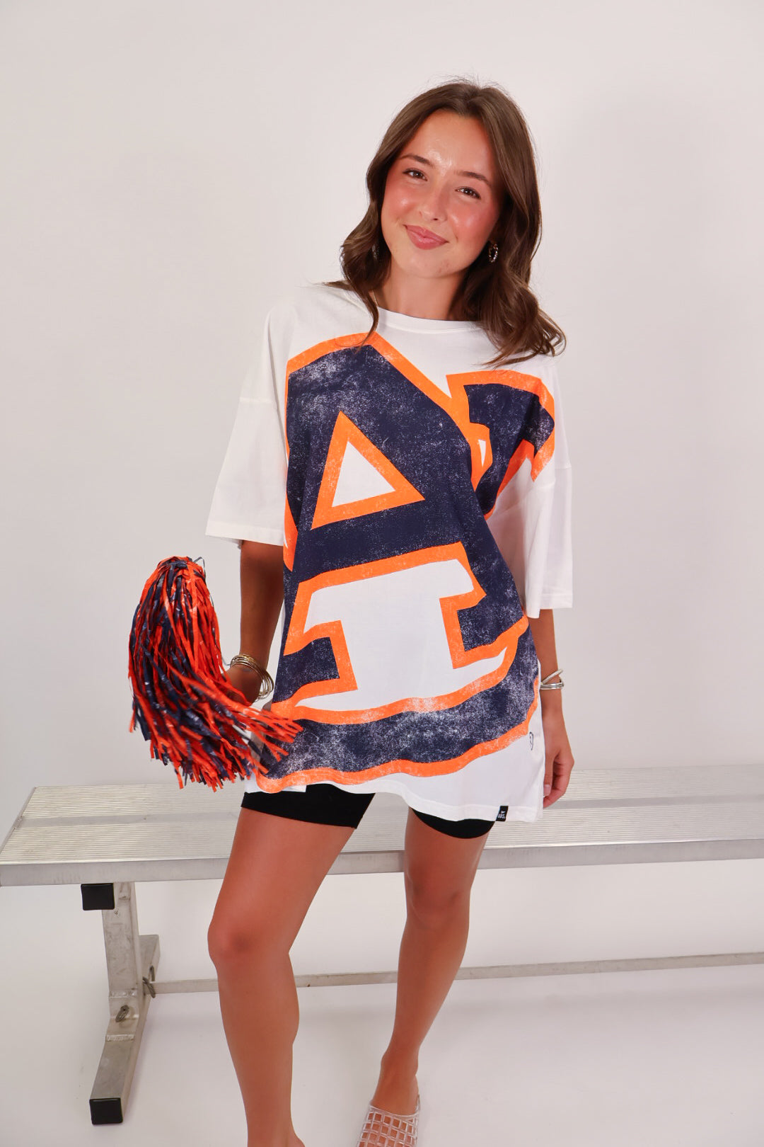 White Auburn Tigers oversized tee with distressed AU logo graphic on model