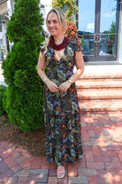Bohemian floral maxi dress with a V-neck, flutter sleeves, and a tiered ruffle skirt