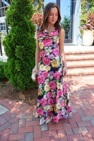 Black floral satin maxi dress with twisted straps and a draped cowl neckline
