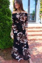 Black and brown floral off-the-shoulder maxi dress with long sheer sleeves