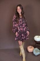 Brown Floral Tiered Babydoll Mini Dress — full outfit with tall boots.