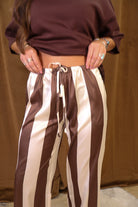Brown And Cream Satin Striped Wide Leg Pants — close-up of drawstring waist.