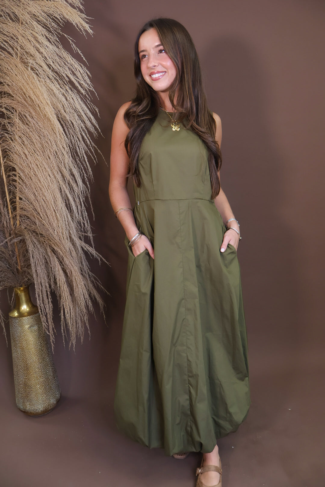 Model wearing the Olive Bubble Midi Dress with Scarf from Moda Boutique