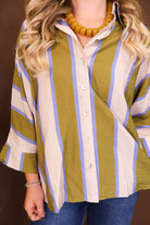 Model wearing the Olive & Blue Striped Button Down Top from Moda Boutique