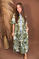 Model wearing the Olive Blue Floral Midi Dress from Moda Boutique